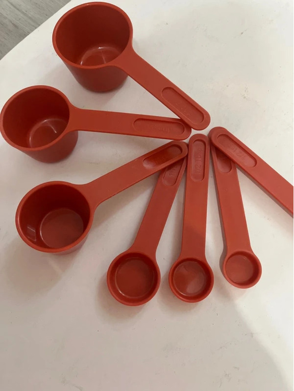 Red measuring cups and spoons